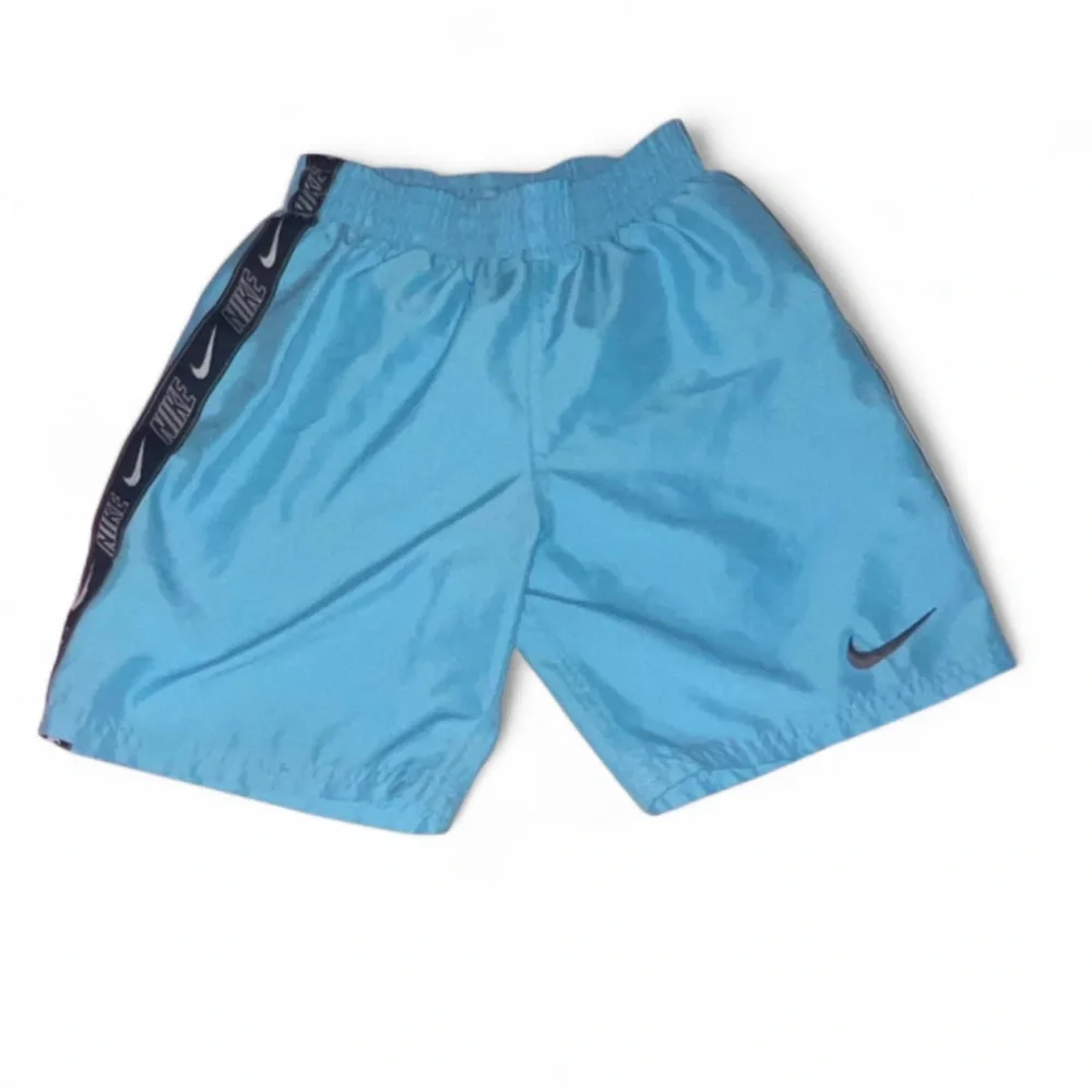 Nike boys swim trunks size 7 blue with black stripe